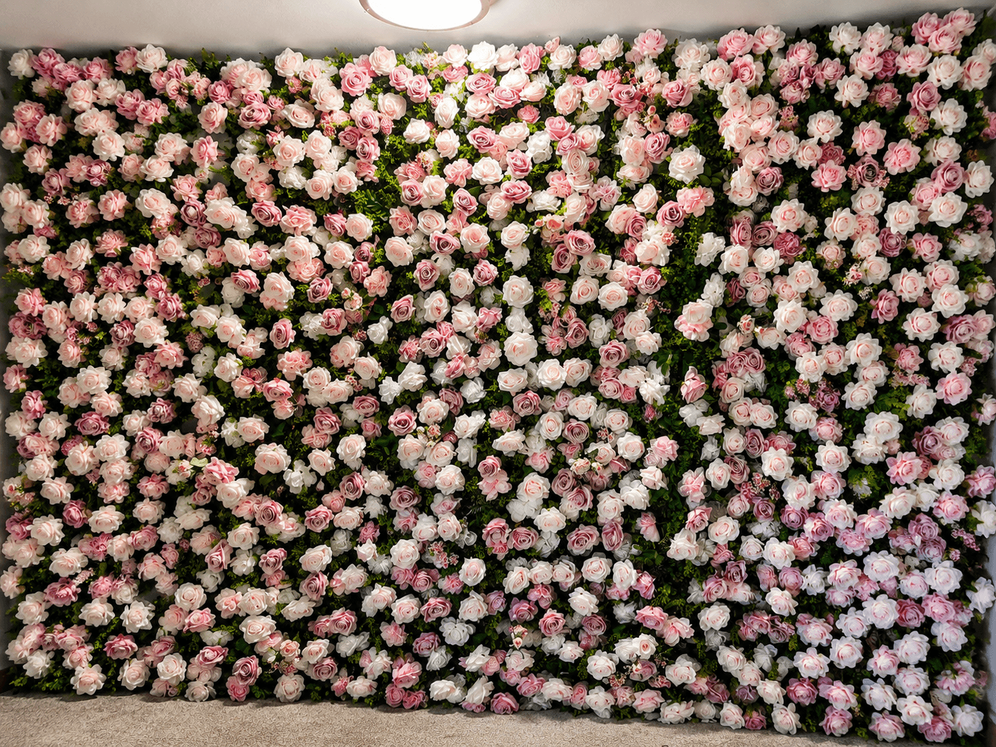 Premium faux floral stems and balloon materials laid out for a custom installation